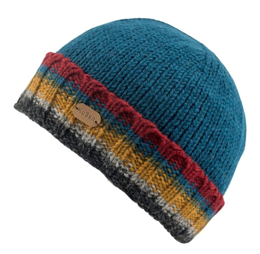 A teal blue ribbed knit beanie hat with a folded cuff featuring a multicolor striped pattern of red, yellow, gray, and white, with a small tan leather patch reading 'KUSAN'.